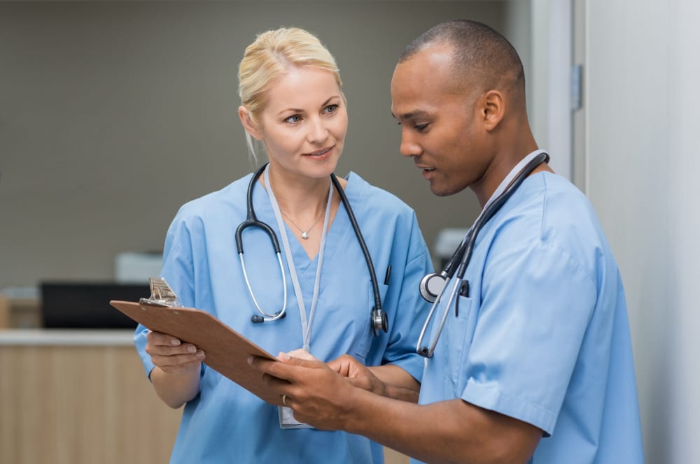 Nurses reviewing a client's care plan