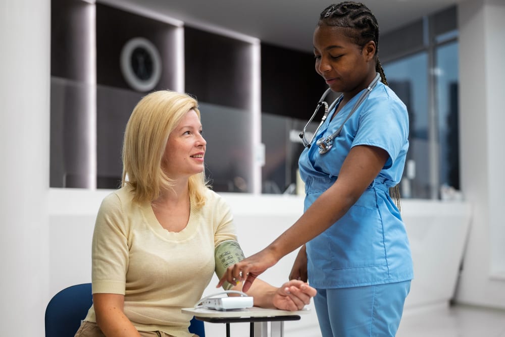 Nurse checking in with a client at home