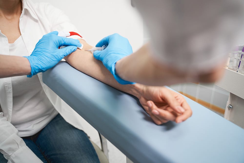 Nurse drawing a blood sample