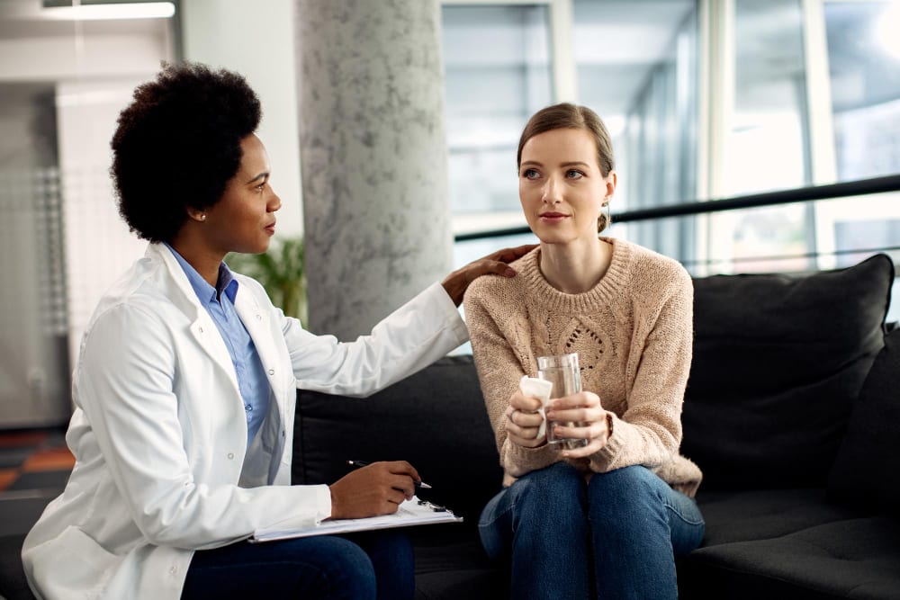 Caregiver checking in with a client at home